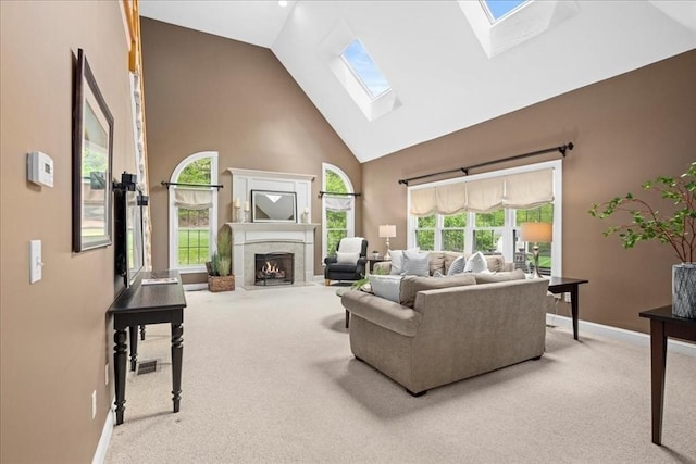17 Fiddleneck Ln, Southborough, MA 01772 - living area with a skylight, carpet floors, high vaulted ceiling, a fireplace, and baseboards