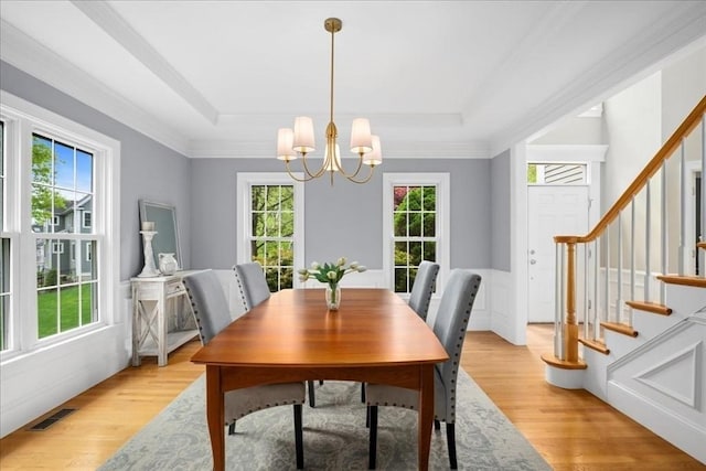 17 Fiddleneck Ln, Southborough, MA 01772 - dining space with plenty of natural light, a chandelier, a tray ceiling, and crown molding