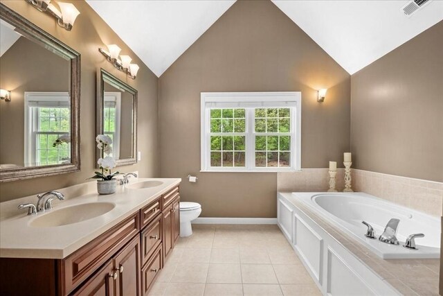 17 Fiddleneck Ln, Southborough, MA 01772 - full bathroom with vaulted ceiling, baseboards, a garden tub, tile patterned floors, and double vanity