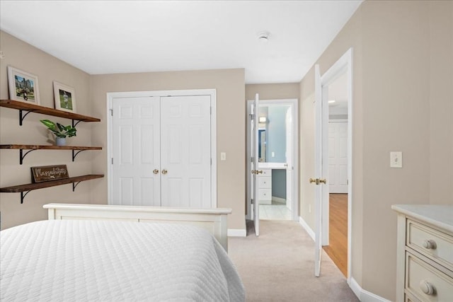 17 Fiddleneck Ln, Southborough, MA 01772 - bedroom featuring light carpet, baseboards, a closet, and connected bathroom