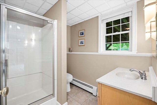 17 Fiddleneck Ln, Southborough, MA 01772 - full bathroom with a baseboard radiator, tile patterned floors, a shower stall, toilet, and vanity