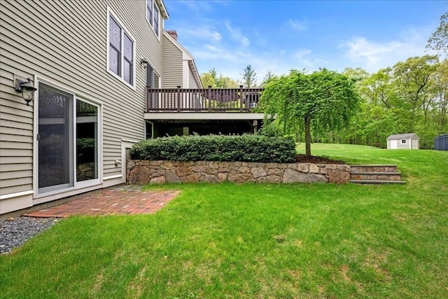 17 Fiddleneck Ln, Southborough, MA 01772 - view of grassy yard featuring a deck, a storage unit, and an outbuilding