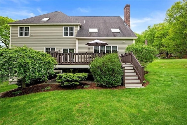 17 Fiddleneck Ln, Southborough, MA 01772 - back of property featuring a chimney, a yard, a deck, and stairway