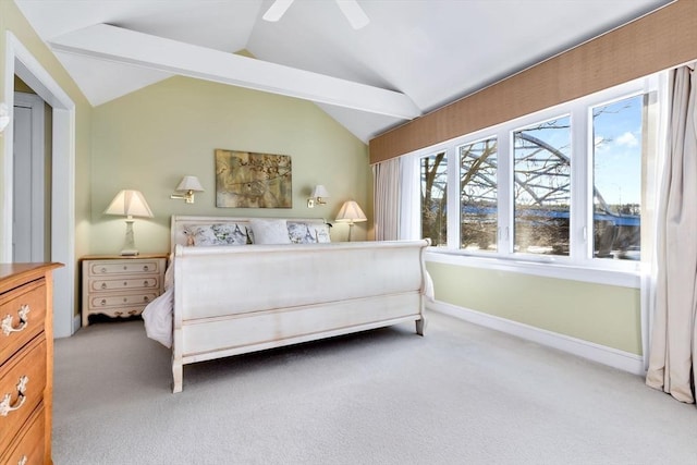 bedroom with ceiling fan, carpet floors, and vaulted ceiling