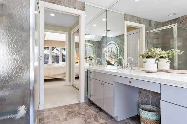 bathroom with vanity and walk in shower