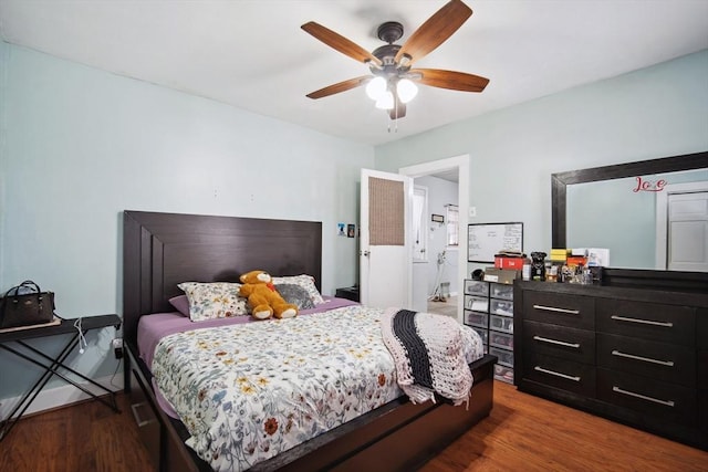 bedroom with ceiling fan and wood-type flooring