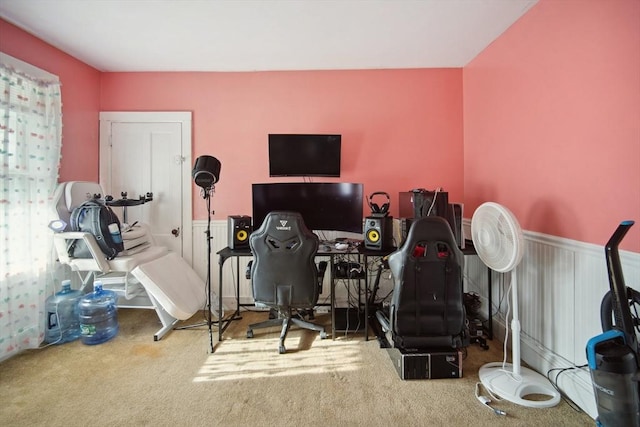 exercise room with a healthy amount of sunlight and carpet floors