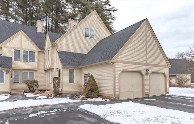 front of property with a garage