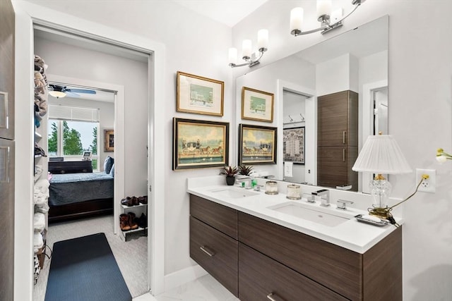 130 Broad Reach Unit 302, Weymouth, MA 02191 - full bathroom featuring ensuite bathroom, double vanity, marble look tile flooring, and ceiling fan