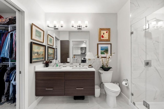 130 Broad Reach Unit 302, Weymouth, MA 02191 - bathroom featuring marble finish flooring, a spacious closet, double vanity, and a marble finish shower