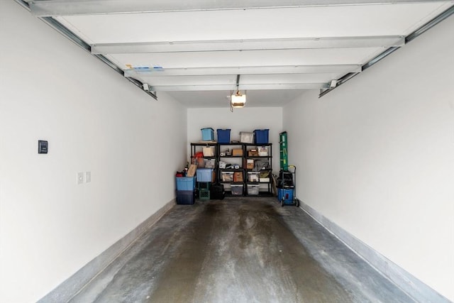 130 Broad Reach Unit 302, Weymouth, MA 02191 - garage with a garage door opener and baseboards