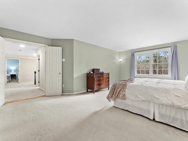 bedroom featuring carpet flooring and baseboards