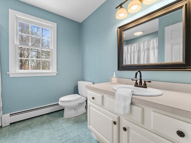 bathroom with tile patterned flooring, baseboard heating, toilet, and vanity