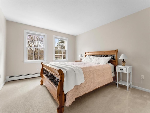 bedroom with light colored carpet, baseboards, and a baseboard radiator