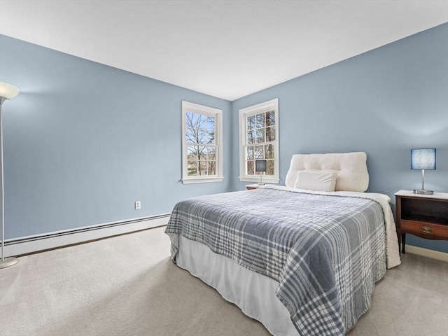 carpeted bedroom featuring a baseboard radiator