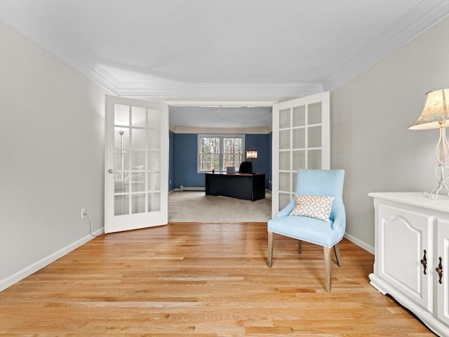 sitting room with a baseboard radiator, crown molding, and french doors