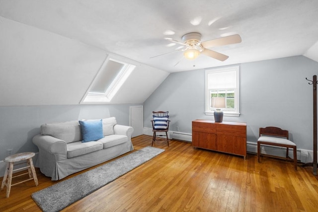 12 Wildwood Ter, Mattapoisett, MA 02739 - additional living space with vaulted ceiling, baseboard heating, a skylight, light wood-style floors, and ceiling fan