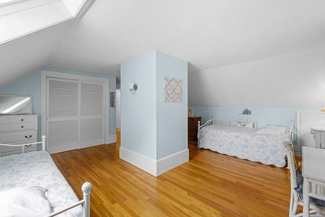 12 Wildwood Ter, Mattapoisett, MA 02739 - bedroom featuring lofted ceiling, wood finished floors, and a closet