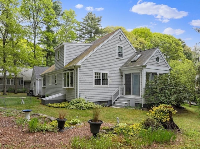 12 Wildwood Ter, Mattapoisett, MA 02739 - rear view of house featuring a sunroom, a yard, and roof with shingles