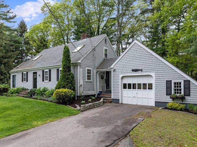12 Wildwood Ter, Mattapoisett, MA 02739 - view of front of property with an attached garage, driveway, a chimney, a front lawn, and a shingled roof