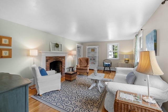 12 Wildwood Ter, Mattapoisett, MA 02739 - living area featuring wood finished floors, a fireplace, and baseboard heating