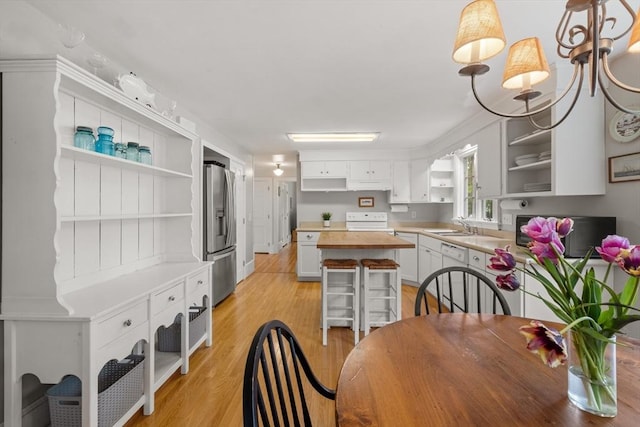 12 Wildwood Ter, Mattapoisett, MA 02739 - dining space with light wood-style flooring