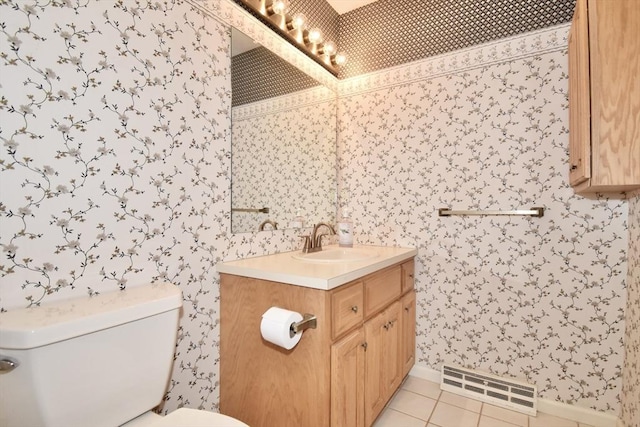 bathroom with vanity, toilet, tile patterned floors, wallpapered walls, and visible vents