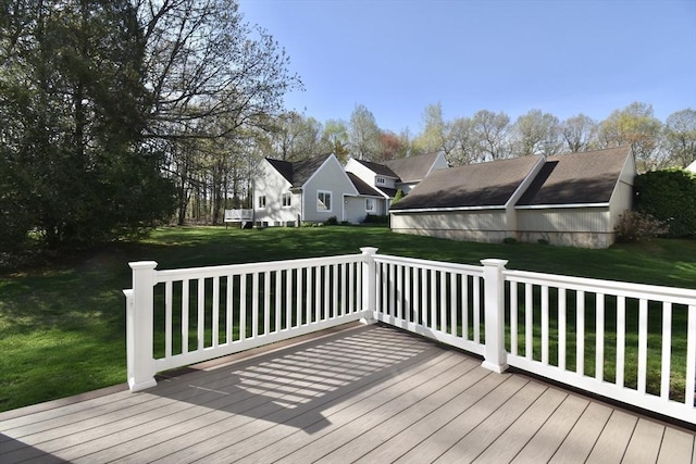 wooden terrace with a lawn and a residential view
