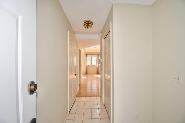 hallway featuring light tile patterned flooring