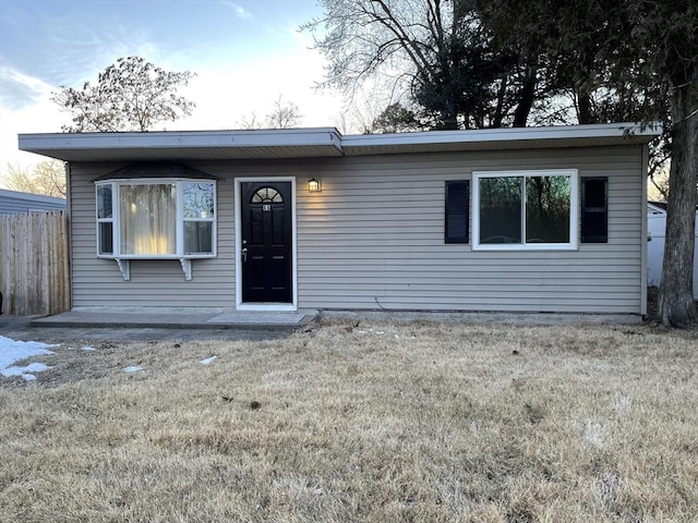 view of front of home with a front lawn