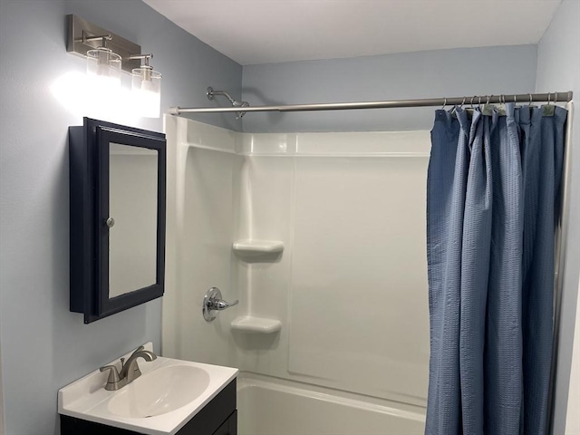 bathroom featuring shower / bath combination with curtain and vanity