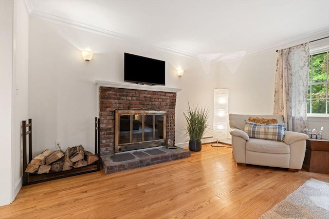 45 Fairfield St, Maynard, MA 01754 - living room featuring ornamental molding, wood finished floors, and a brick fireplace