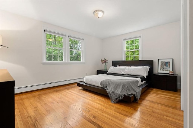 45 Fairfield St, Maynard, MA 01754 - bedroom with baseboard heating and light wood-type flooring