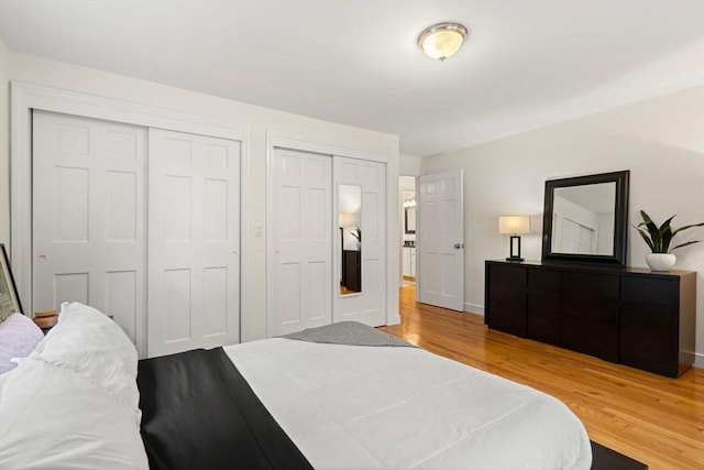 45 Fairfield St, Maynard, MA 01754 - bedroom with wood finished floors, two closets, and baseboards