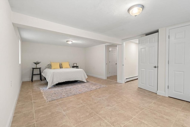 45 Fairfield St, Maynard, MA 01754 - bedroom featuring a baseboard radiator, baseboards, and light tile patterned floors