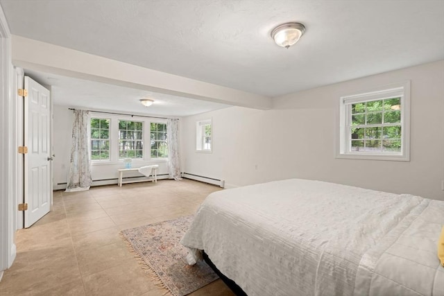 45 Fairfield St, Maynard, MA 01754 - bedroom with a baseboard radiator and light tile patterned flooring