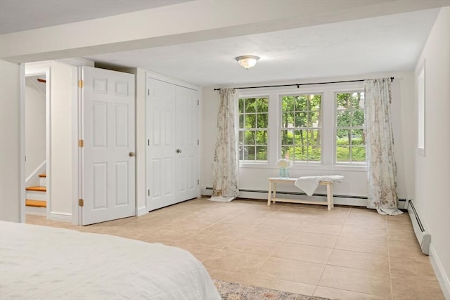 45 Fairfield St, Maynard, MA 01754 - bedroom featuring light tile patterned floors, baseboard heating, and baseboards
