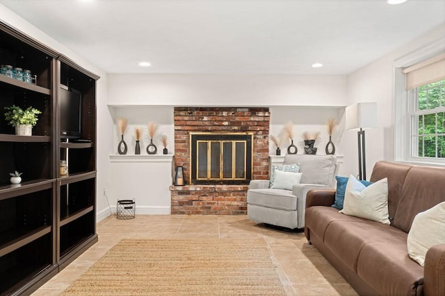 45 Fairfield St, Maynard, MA 01754 - tiled living room featuring a brick fireplace and recessed lighting