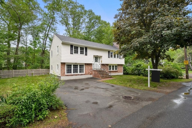 45 Fairfield St, Maynard, MA 01754 - bi-level home with asphalt driveway, entry steps, and brick siding