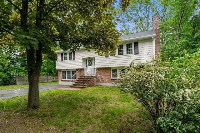45 Fairfield St, Maynard, MA 01754 - split foyer home with a chimney and brick siding
