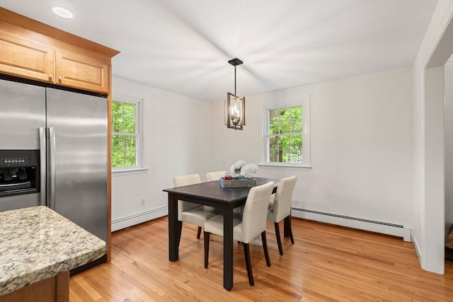 45 Fairfield St, Maynard, MA 01754 - dining area with a baseboard heating unit, plenty of natural light, baseboard heating, and light wood-type flooring