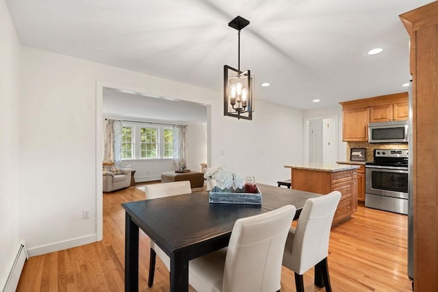 45 Fairfield St, Maynard, MA 01754 - dining space featuring a baseboard radiator, light wood-style flooring, baseboards, recessed lighting, and a chandelier