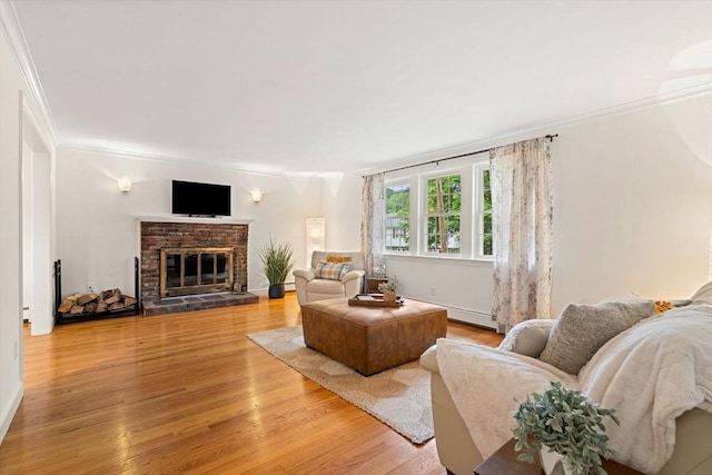 45 Fairfield St, Maynard, MA 01754 - living area featuring crown molding, light wood-type flooring, and a brick fireplace