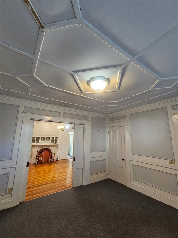 interior space featuring dark colored carpet