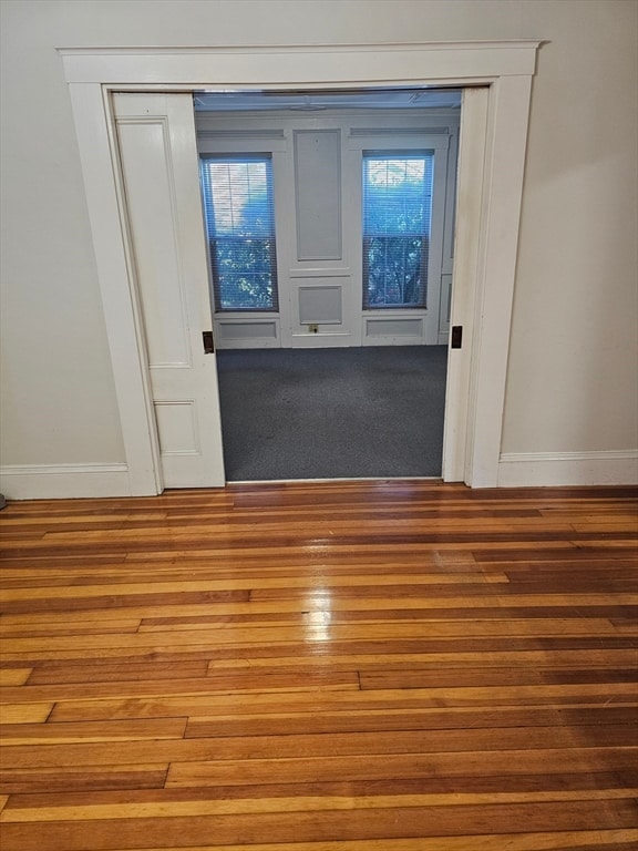 interior space with hardwood / wood-style floors and a healthy amount of sunlight