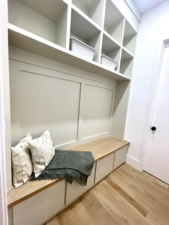 156-158 Langley Rd Unit 1, Newton, MA 02459 - mudroom featuring light wood-style flooring