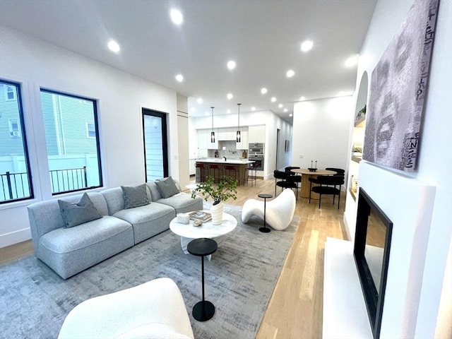 156-158 Langley Rd Unit 1, Newton, MA 02459 - living area featuring light wood-type flooring and recessed lighting