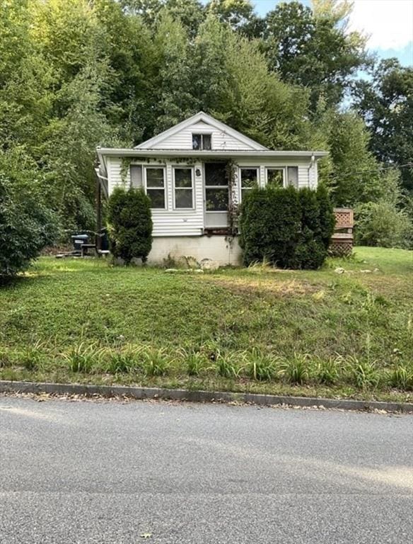 bungalow with a front yard