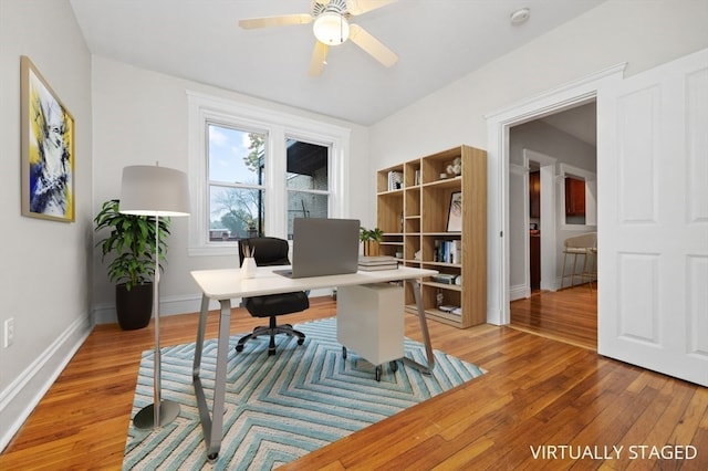 office area with wood-type flooring and ceiling fan