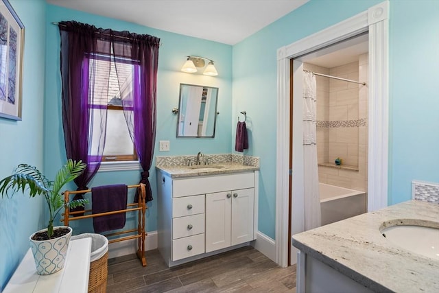 18 Hill St, Lexington, MA 02421 - full bath with vanity, wood finished floors, baseboards, and shower / bath combo